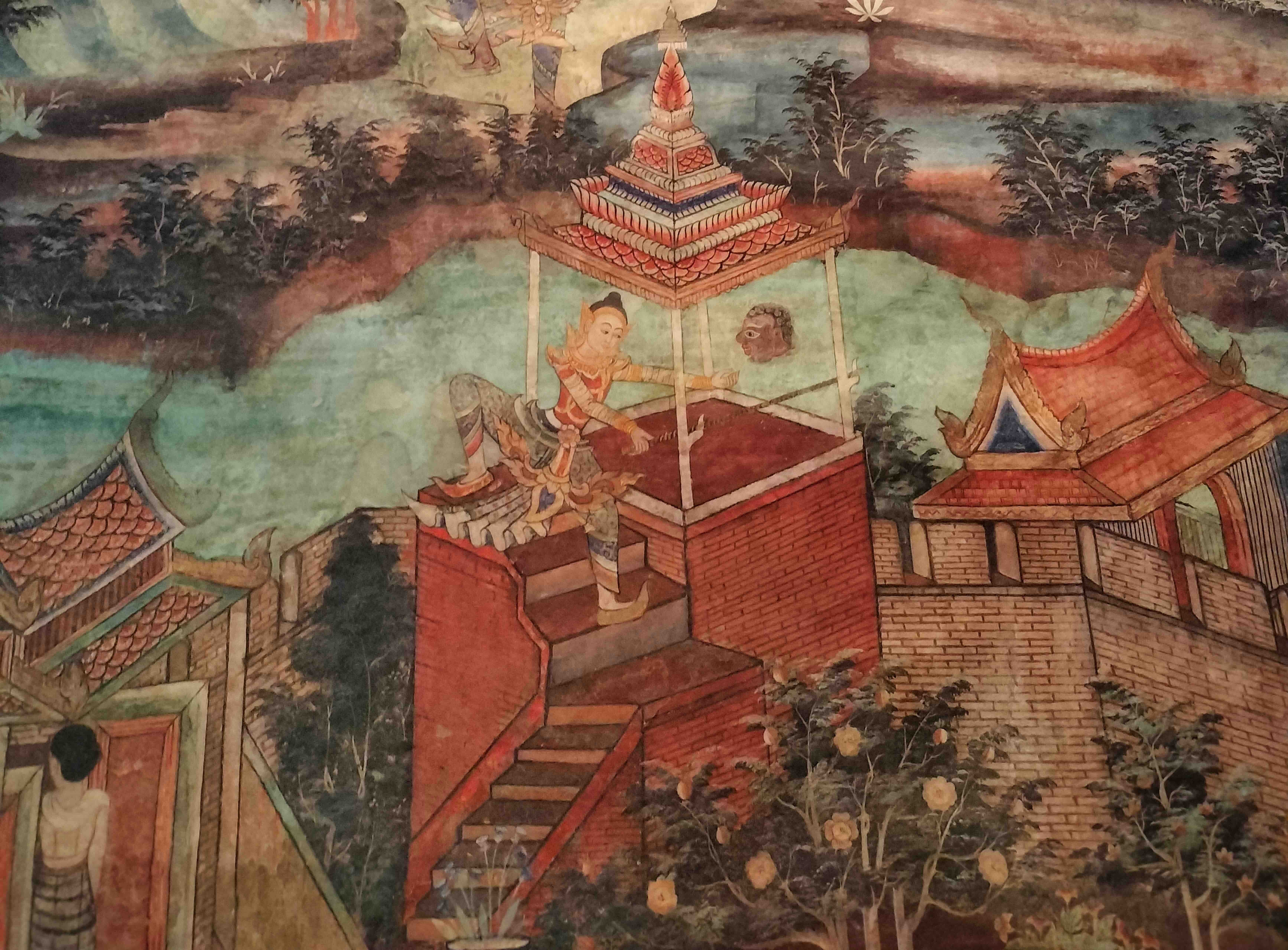 Murals from the Isan region, such as those at Wat Sanuan Wari, vividly capture the mid-air combat of the Vidyadharas. Their faces, contorted in desire, create a stark moral contrast with the serene fruit-maidens.